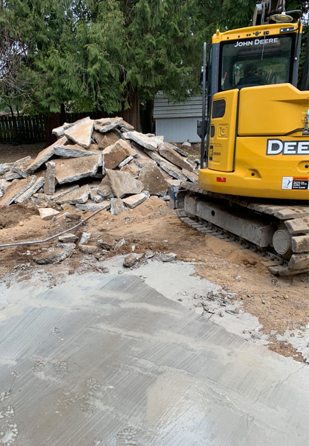 excavator prepping construction site